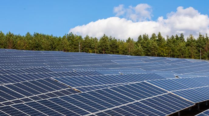 Aerial view of a large-scale solar power installation in Chapalgaon, Maharashtra, commissioned by Juniper Green Energy.