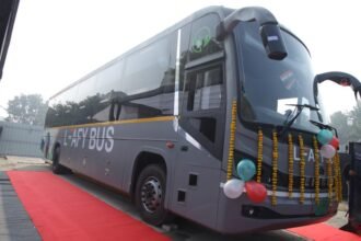 Electric intercity sleeper bus from LeafyBus and Eicher on a national highway, representing long-distance clean mobility.
