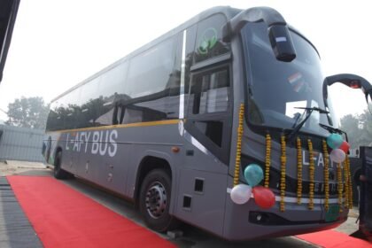 Electric intercity sleeper bus from LeafyBus and Eicher on a national highway, representing long-distance clean mobility.